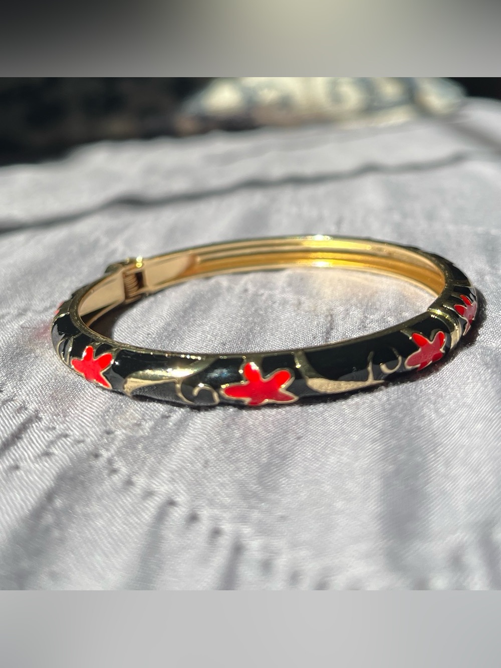 Gold-Tone Black Enamel Bangle with Red Flower Accents